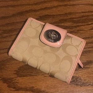 Coach wallet pink and tan.